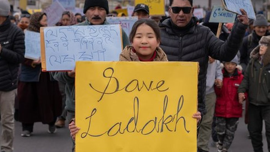 Ladakhi girl displaying placard 'save Ladakh' 